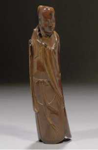Ming dynasty A stained ivory figure of an immortal